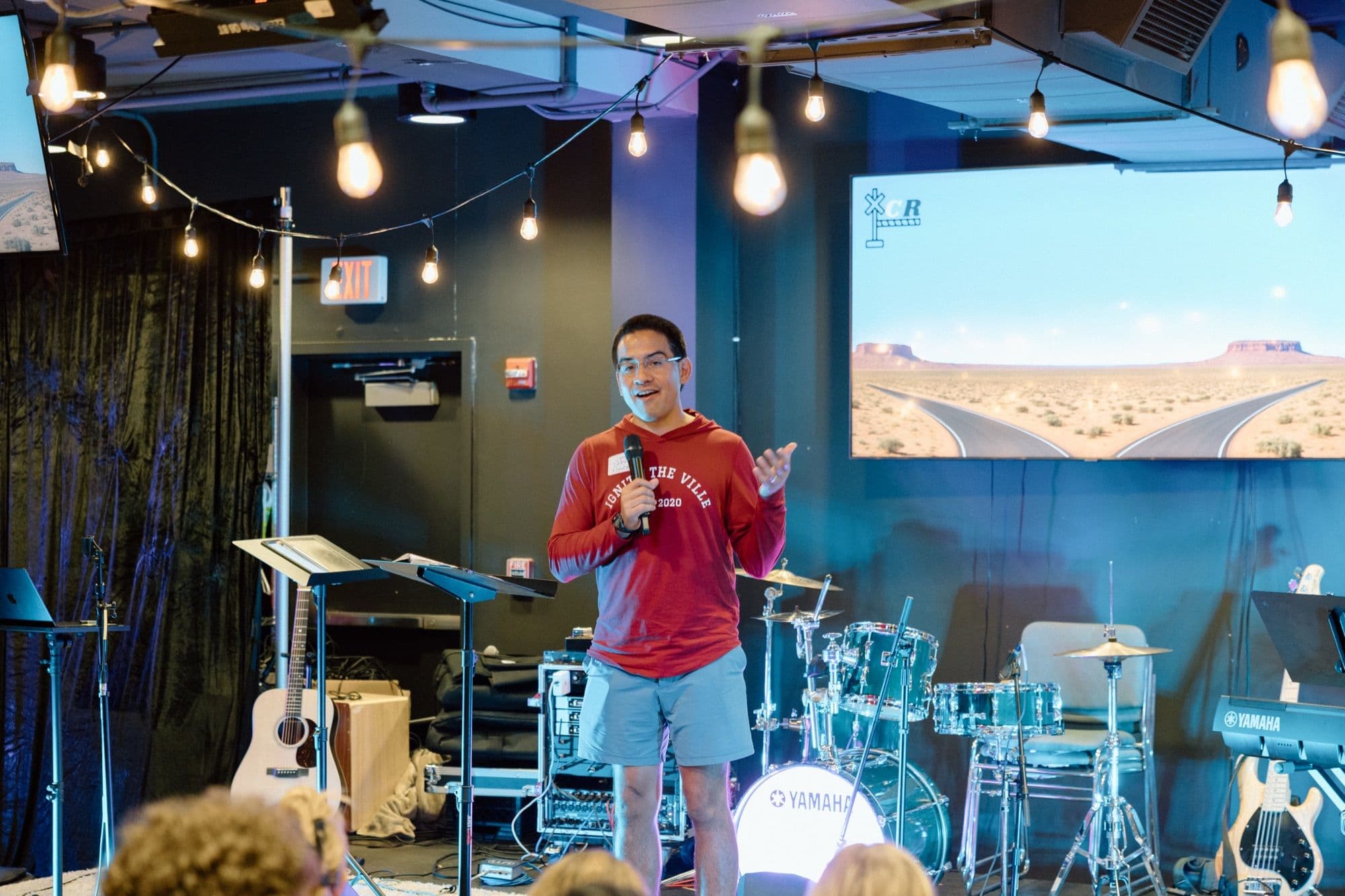 A student speaking to the room at an Ignite gathering
